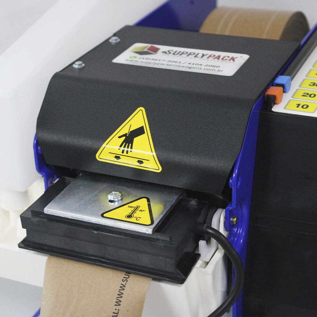 Detalhe do aquecedor de goma do Lapomatic, com aviso de temperatura de 80 a 100 °C